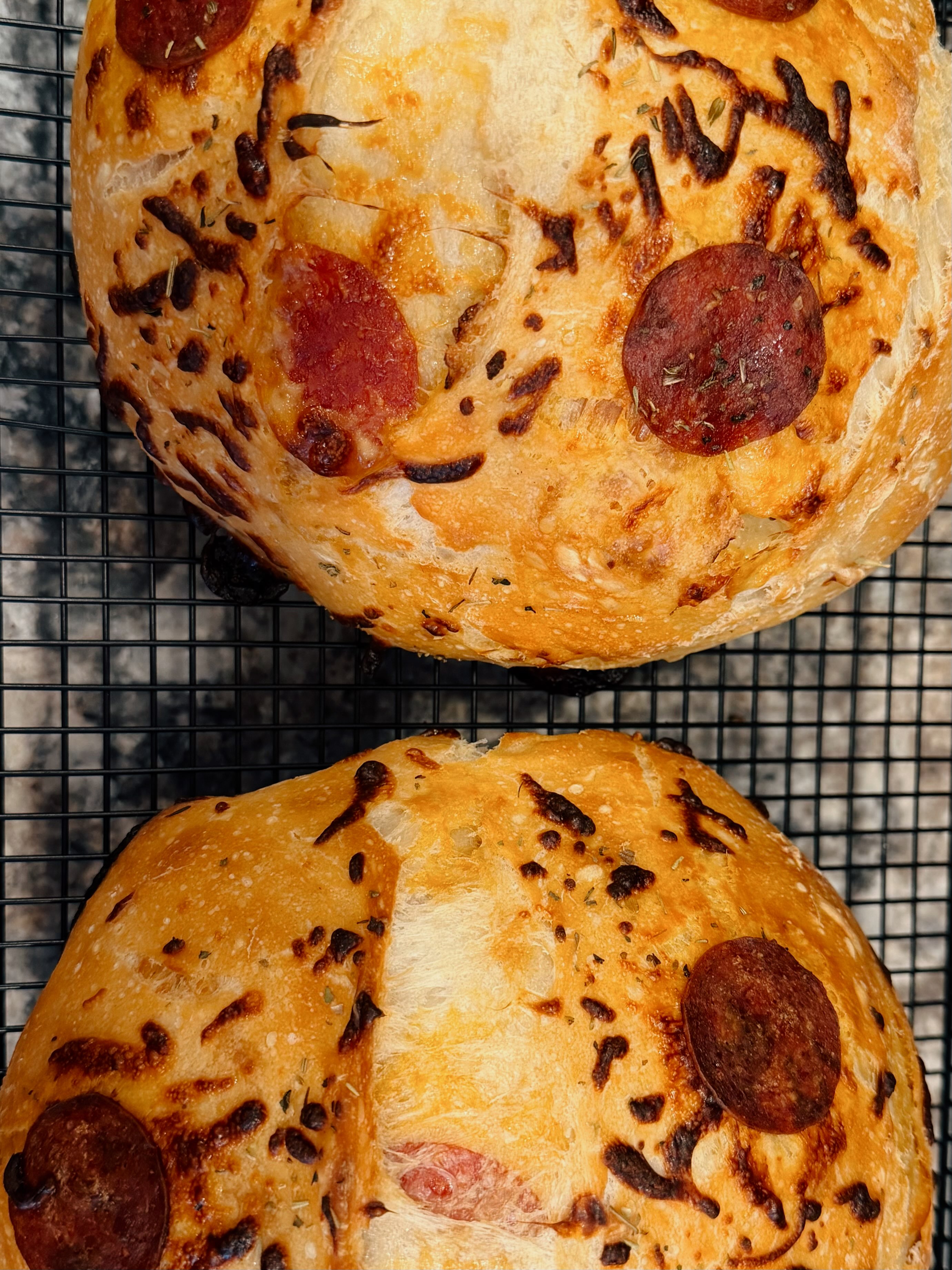 Madisen’s round pizza sourdough loaves with pepperoni and baked cheese